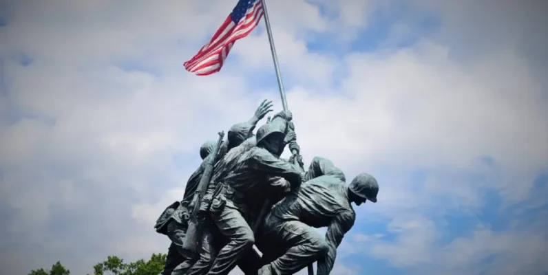 Iwo Jima Memorial depicting soldiers raising the American flag against a blue sky.