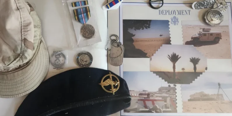 Scrapbook, berets, dogtags, badge, coins, military ribbon, military medal.