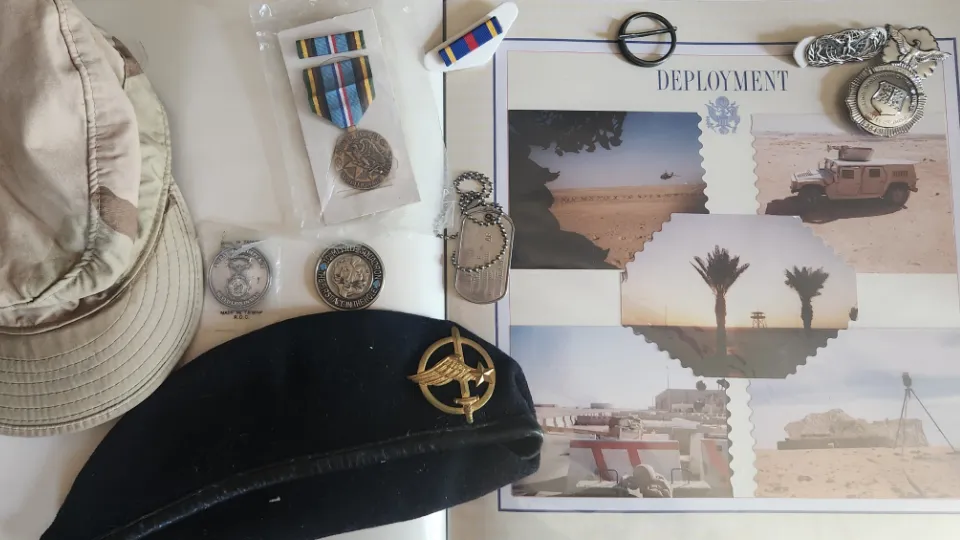 Scrapbook, berets, dogtags, badge, coins, military ribbon, military medal.