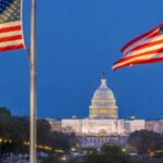 Amercian flag flying close to the US Capitol building.